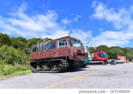 Snowmobiles waiting for the season, ski slopes, Tambara Ski Park 107249004