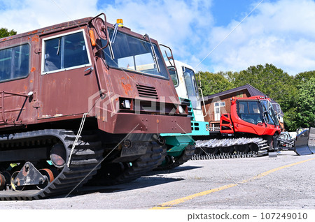 Snowmobiles waiting for the season, ski slopes, Tambara Ski Park 107249010
