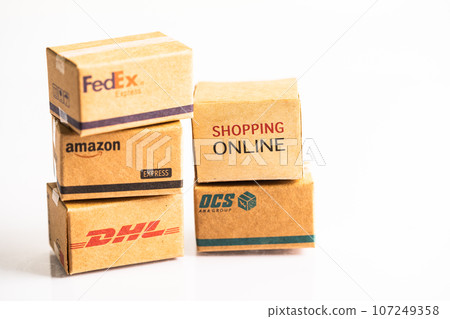 Bangkok, Thailand September 26, 2022 Shopping cart with DHL Amazon and FedEx express packing box, import export online exchange investment business. 107249358