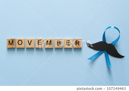 Movember concept - event to raise awareness of men's health issues, moustache anf blue ribbon 107249463