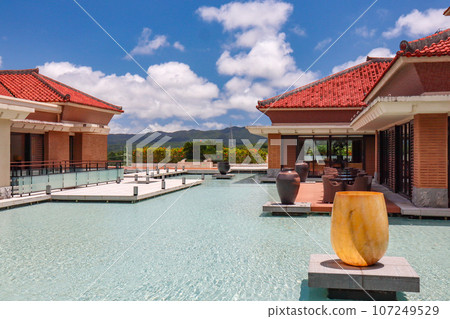 Exterior view of The Ritz-Carlton Okinawa, a luxury resort hotel in tropical Okinawa Exterior view of The Ritz-Carlton Okinawa, a luxury resort hotel in tropical Okinawa 107249529