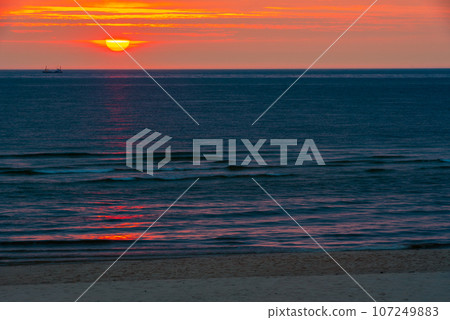 Sunset over sea on Sylt island, Germany Sunset over sea on Sylt island, Germany 107249883