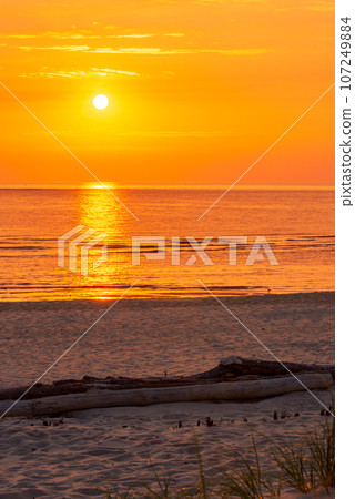 Sunset scenery on Sylt island beach in North Sea, in Germany 107249884