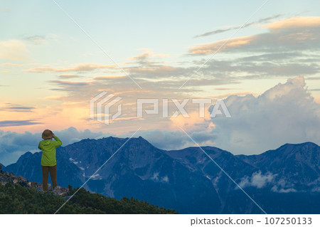 A woman looking at the view from the top of Mt. Jigatake 107250133
