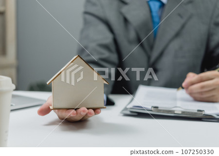 Insurance broker and loan with bank or house agent, real estate , house sale contract signing business concept. Insurance broker and loan with bank or house agent, real estate , house sale contract signing business concept. 107250330