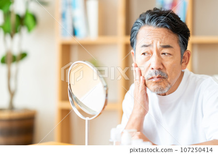 Senior men concerned about their skin condition 107250414