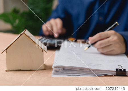 Real estate and investment, buying a house by contract or loan finance and banking. home insurance or property. Real estate and investment, buying a house by contract or loan finance and banking. home insurance or property. 107250443