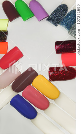 Palette of multi-colored nail polishes. Manicure and gel polish color choice. Palette of multi-colored nail polishes. Manicure and gel polish color choice. 107251699