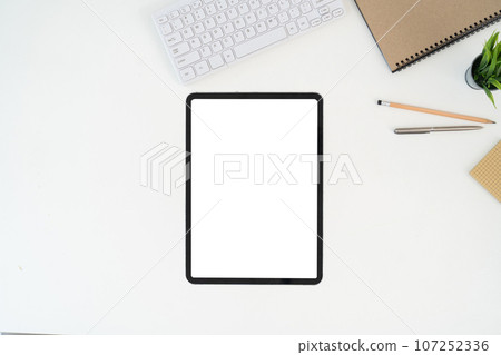 Modern desk workspace with blank copy space mockup with blank screen tablet, coffee cup, technology, headphones with equipment other office top view freelance business concept for social media Modern desk workspace with blank copy space mockup with blank screen tablet, coffee cup, technology, headphones with equipment other office top view freelance business concept for social media 107252336