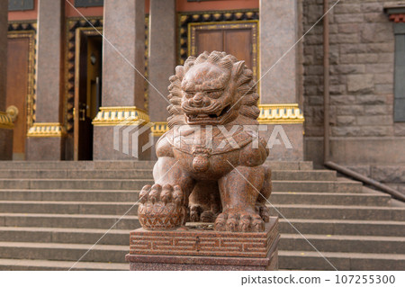 stone statue of a lion at the entrance to the Buddhist datsan Gunzechoinei stone statue of a lion at the entrance to the Buddhist datsan Gunzechoinei 107255300