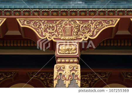 fragment of the facade of a Buddhist datsan Gunzechoinei building with traditional elements 107255369