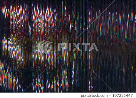 Glitch distortion. Vhs noise. Abstract pattern. Black background with blue yellow red green zigzag lines interference analog TV texture. 107255447