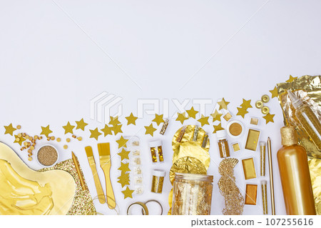 Golden art crafts for drawing around. View from above. Drawing tools and golden creativ supplies. 107255616