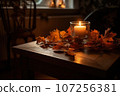 Autumn atmosphere, candles and autumn leaves on a wooden table 107256381