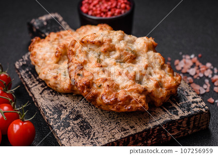 Delicious fried chicken chop or pork meat fried breaded with salt, spices and herbs 107256959