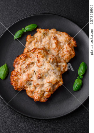 Delicious fried chicken chop or pork meat fried breaded with salt, spices and herbs 107256965