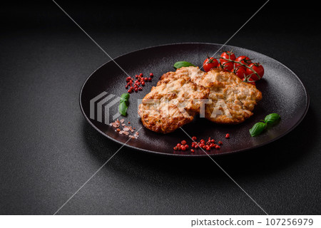 Delicious fried chicken chop or pork meat fried breaded with salt, spices and herbs 107256979