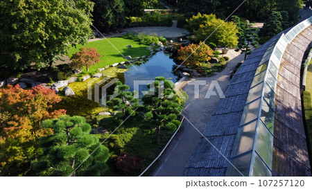 Drone point of view on Japanese garden of in Botanical garden Planten un Blomen in Hamburg Drone point of view on Japanese garden of in Botanical garden Planten un Blomen in Hamburg 107257120