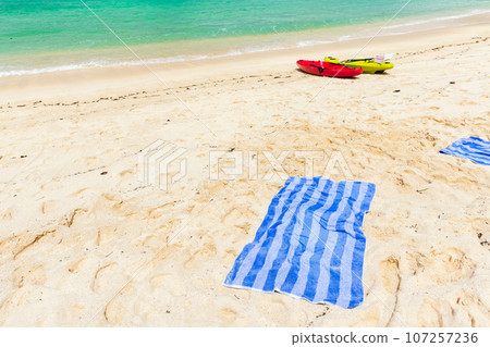 Seychelles beach landscape with blue towels Seychelles beach landscape with blue towels 107257236