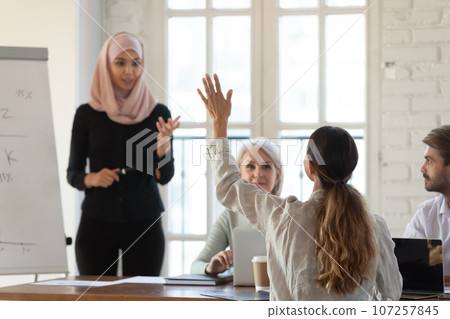 Participant raise hand want ask question to coach at seminar 107257845