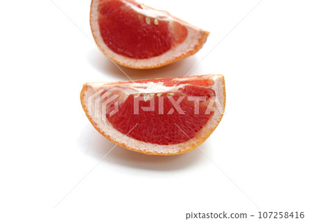 Fresh grapefruit on white background. 107258416