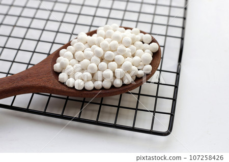 Big tapioca pearls, sago seeds Big tapioca pearls, sago seeds 107258426