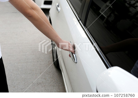 Male hand opening car door Male hand opening car door 107258760