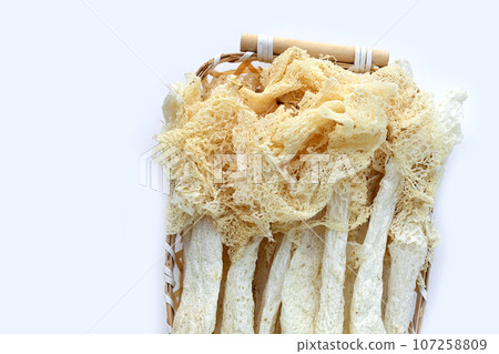Dried tropical stinkhorn mushroom in bamboo basket 107258809