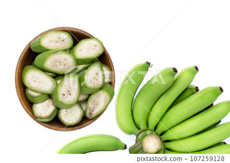 Raw banana slices on white background. Raw banana slices on white background. 107259128