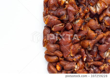 Sour tamarind on white background. 107259228
