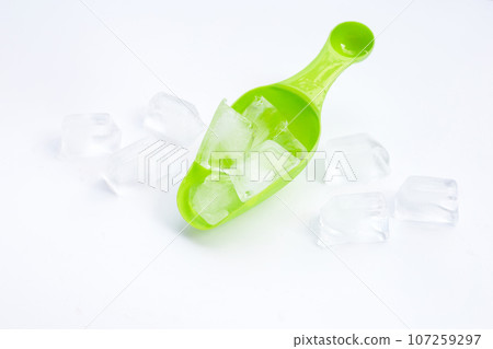 Ice cubes with ice scoop. 107259297