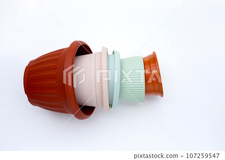 Plastic plant pots, containers on white background. Plastic plant pots, containers on white background. 107259547
