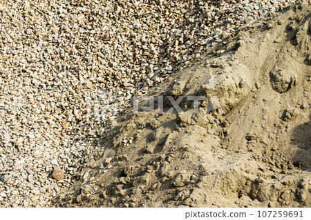 Sand and gravel. View from above. Construction material. Background. 107259691