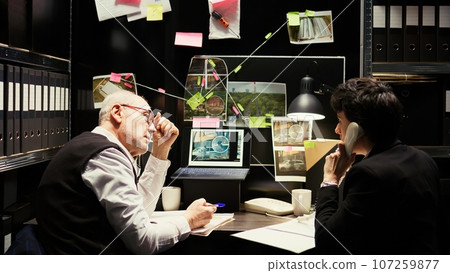 Partners receiving suspect whereabouts, running to catch culprit at secret location. Police officers finding gps coordinates on landline phone call, uncover new case information. 107259877