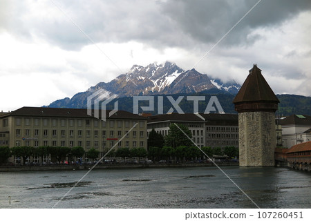 River Reuss in Lucerne (Switzerland) and Mount Pilatus in the background River Reuss in Lucerne (Switzerland) and Mount Pilatus in the background 107260451