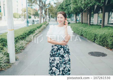 Photo of a young woman with a smartphone 107261530
