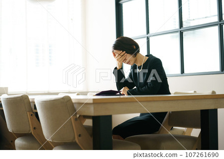 A sad woman in mourning clothes 107261690