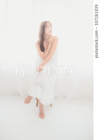 Photo of a young woman standing indoors Photo of a young woman standing indoors 107261839