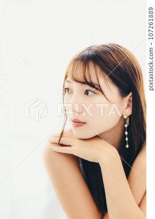 Photo of a young woman standing indoors 107261889