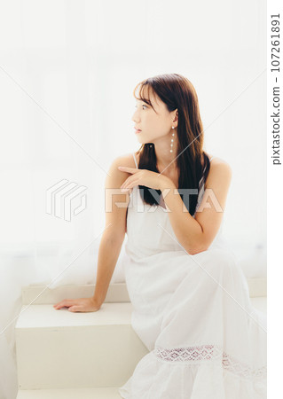 Photo of a young woman standing indoors 107261891