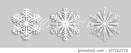 White snowflakes with paper effect on a gray background for winter design. 107262578