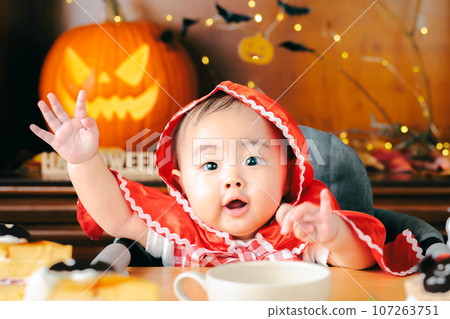 Homemade Halloween party baby Little Red Riding Hood copy space Homemade Halloween party baby Little Red Riding Hood copy space 107263751