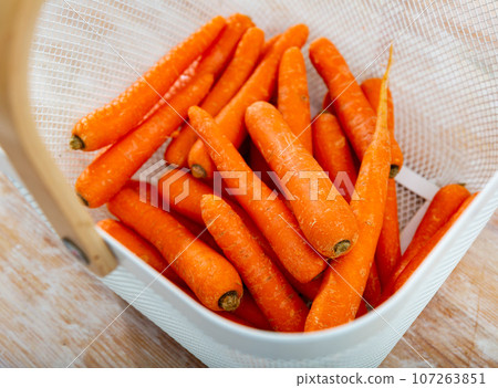 Image of fresh carrots in a bucket 107263851