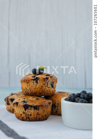 Homemade baked blueberry muffins with fresh blackberries. Tasty pastry sweet cupcake dessert. Berry pie cupcakes with organic berries. Gluten free healthcare recipe from alternative flour  107265681