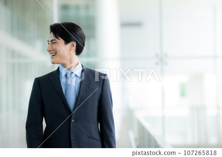 young man wearing a suit young man wearing a suit 107265818