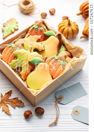 Multicolored autumn homemade cookies in a gift box Multicolored autumn homemade cookies in a gift box 107267615