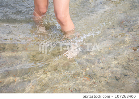 Image of a child playing in the water 107268400