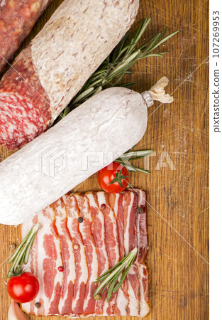 Various Smoked sausage with rosemary and peppercorns tomatoes and garlic 107269953