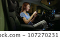 businesswoman use smartphone in car 107270231