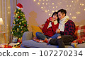 couple sitting together on xmas 107270234